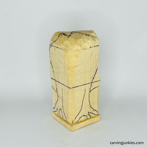 Sketching legs on wooden frog