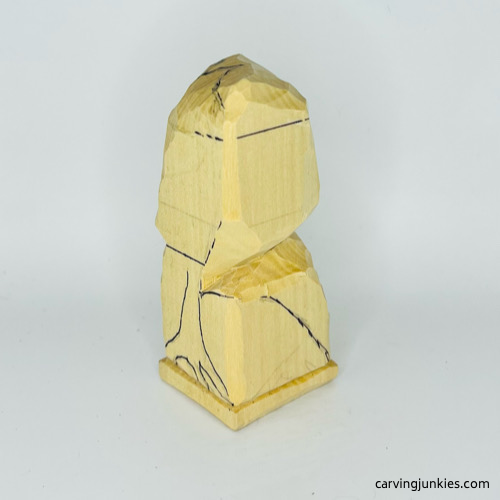 Left view of head on wooden frog carving