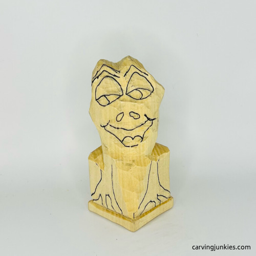 Progress photo of frog wood carving