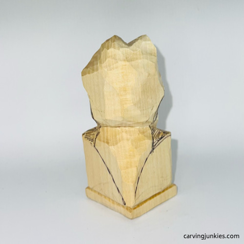 Marked wood to remove on frog carving