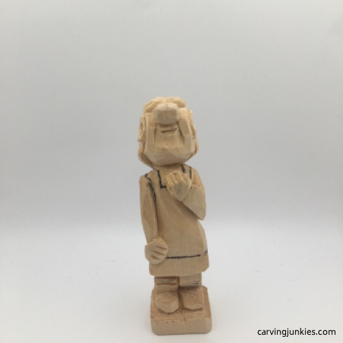 Carved fingers on female wood carving