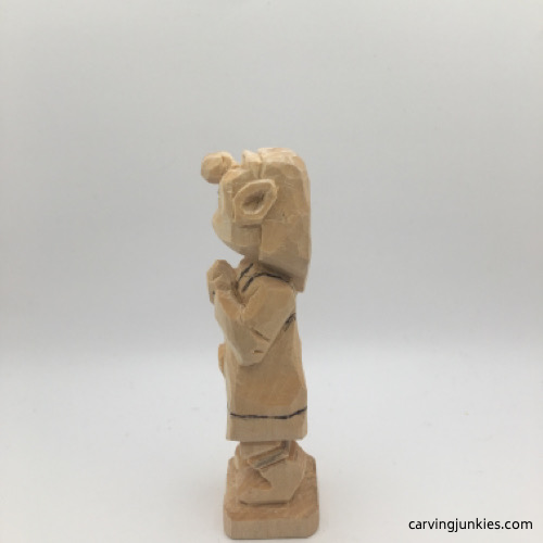 Left view of apron on female wood carving