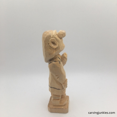 Right view of apron on female wood carving