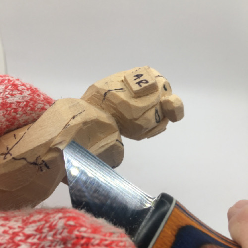 Carved arms on female wood carving