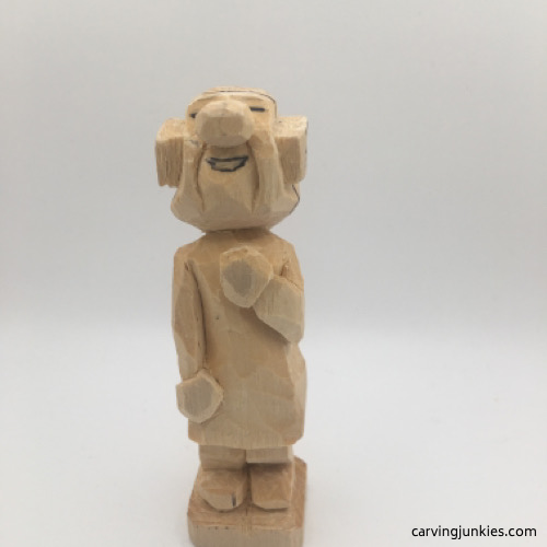 Rounded hands on female wood carving