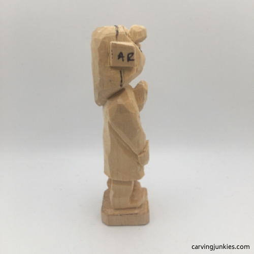 Right side of hands on female wood carving