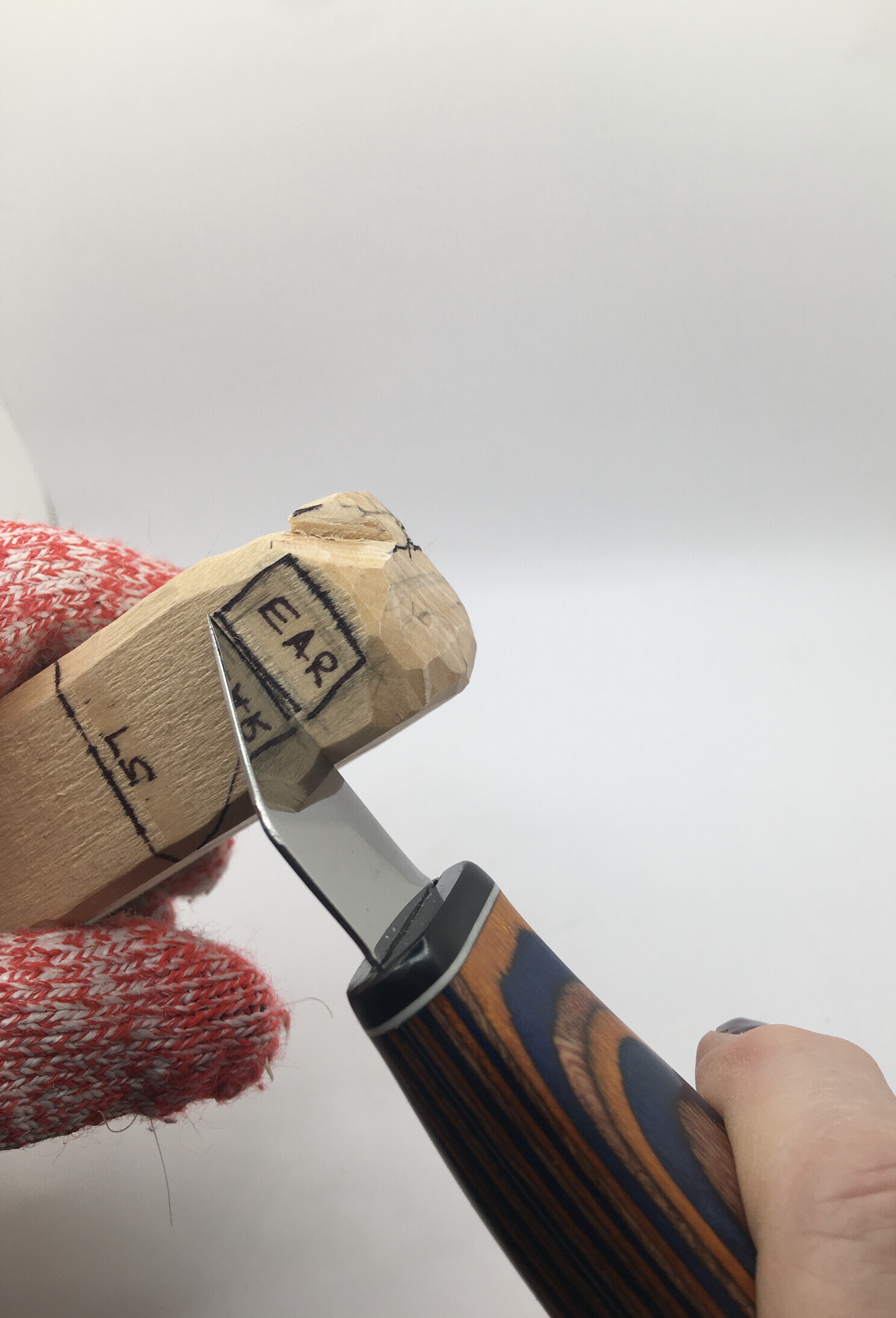 Starting ear on female wood carving