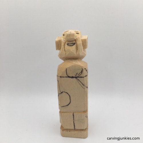 Cut smile lines on female wood carving