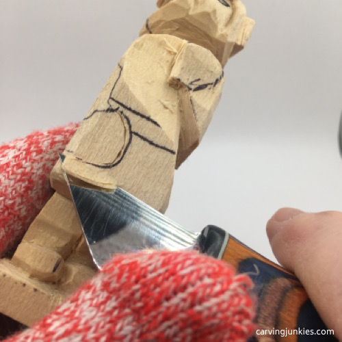Separating hands on female wood carving
