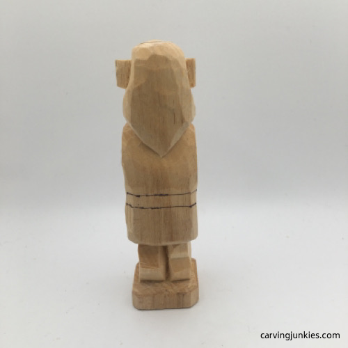 Back view of boots on female wood carving