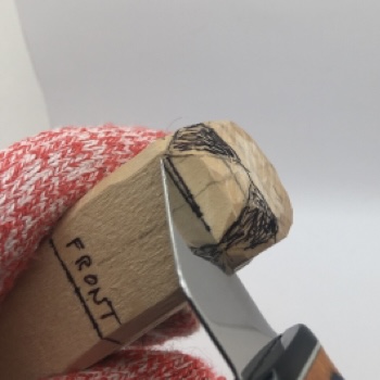 Stop cut under nose of female wood carving