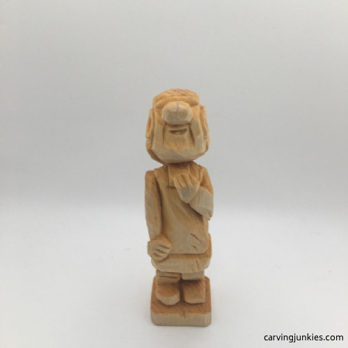 Unfinished front of female wood carving