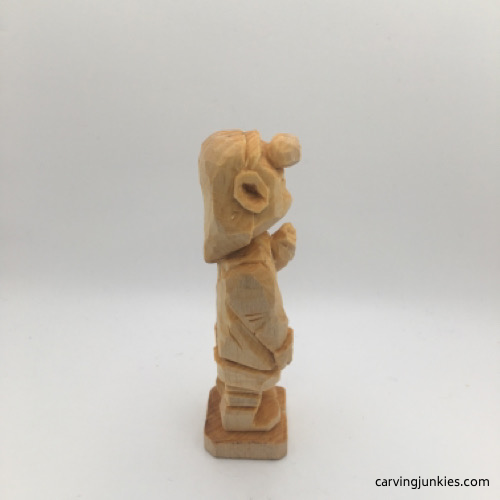 Right side of unfinished female wood carving