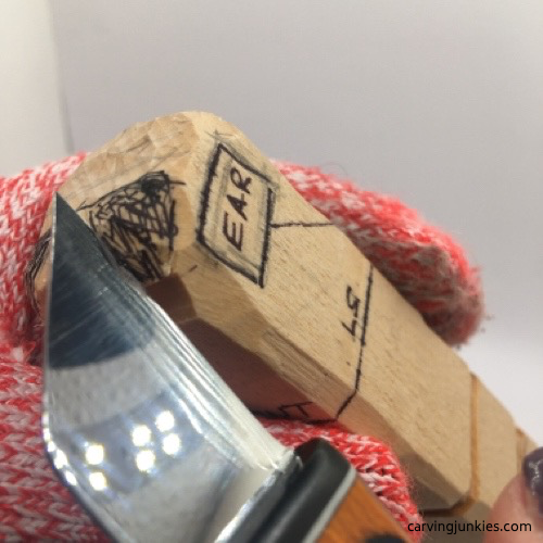 Pyramid cut on female wood carving