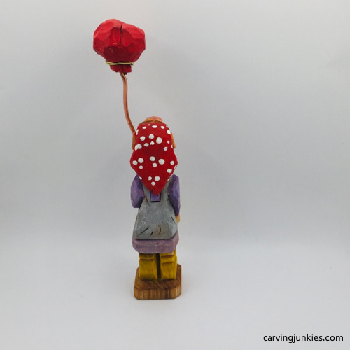 Back view of painted wood carved woman