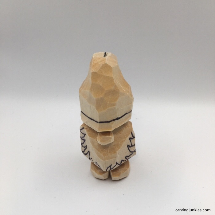 Face drawn on wooden gnome