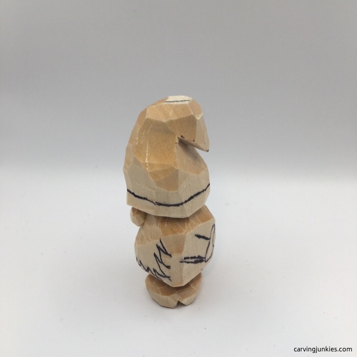 Left view of gnome carved from wood