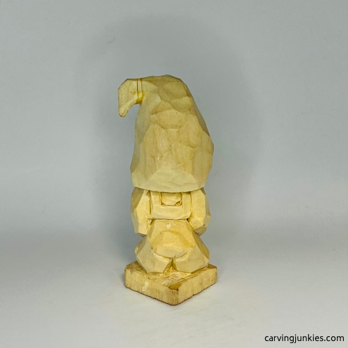 Carved details on back of gnome carving