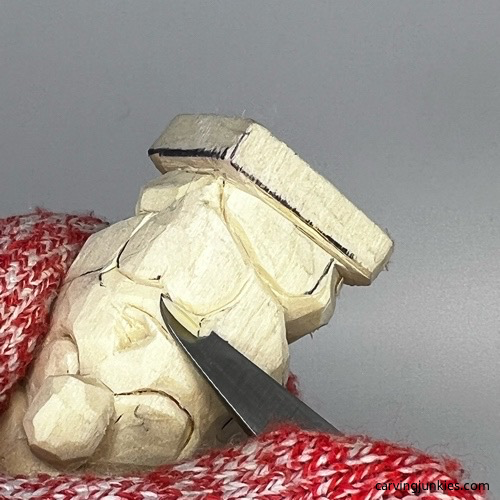 Carving heart on gnome carving