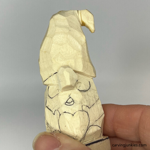 Shaped hat on gnome carving