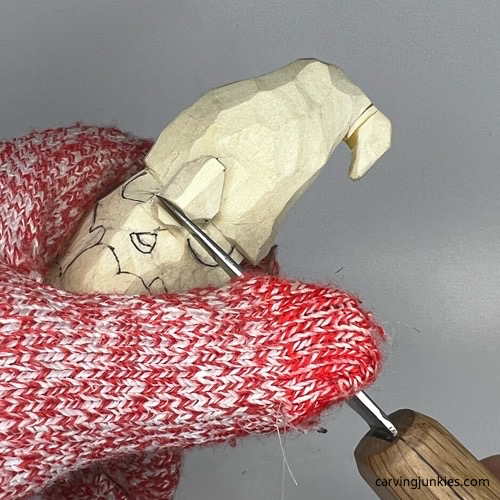 Angling nose on gnome carving