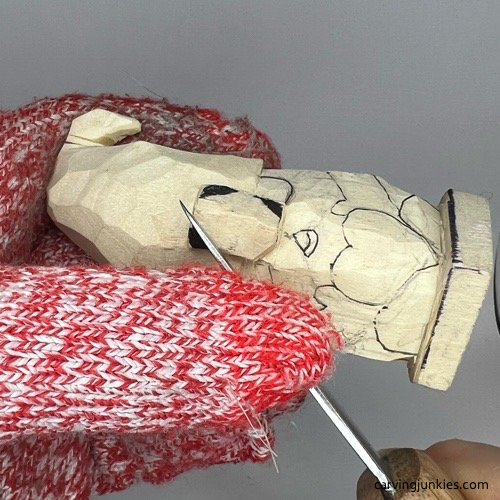 Refining nose on gnome carving