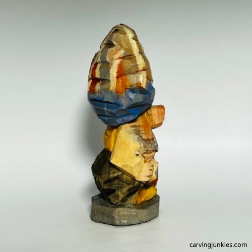 Right side of painted gnome carving