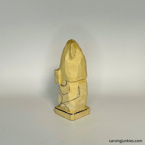 Left view of details on gnome carving