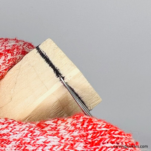 Making a stop cut on gnome carving