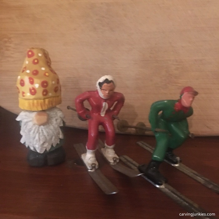 Gnome watching skiers