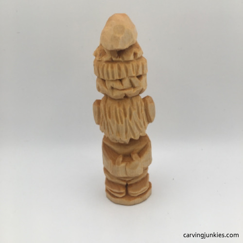Back side of finished wood carved gnome before painting