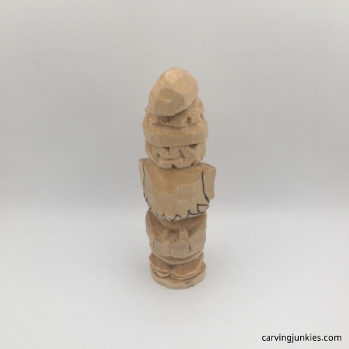 Carving hair on back of wooden gnome