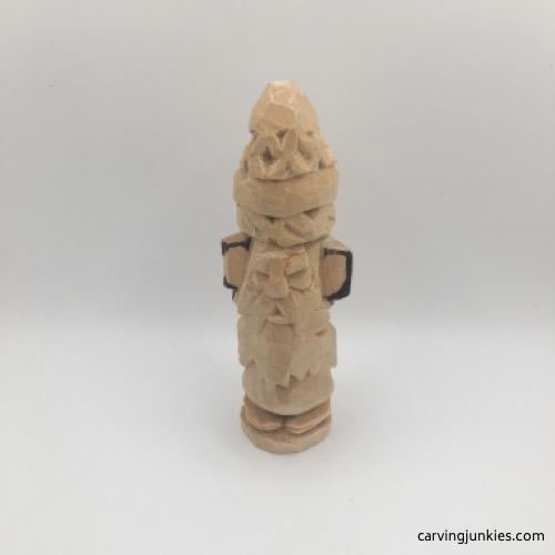 Shaping ears on wood carved gnome