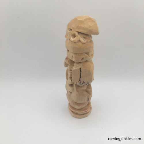 Carved hair on left side of wooden gnome