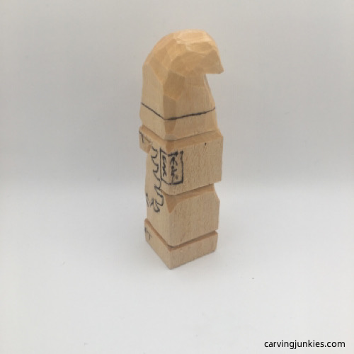 Left view of gnome carving in progress with boxed ears