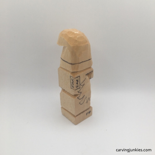 Right side of wooden gnome carving in progress
