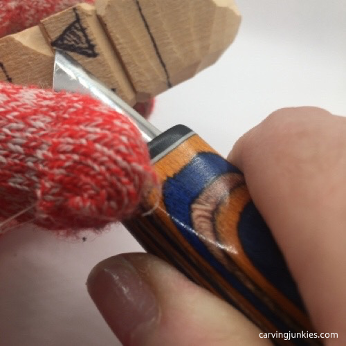 Carving right nostril on gnome carving