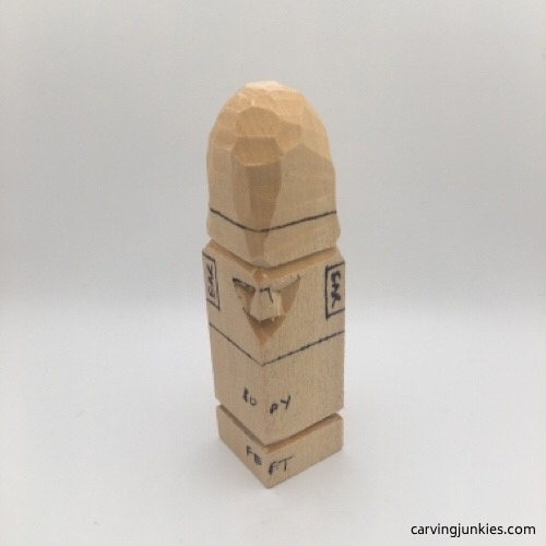 Shaping nose on wooden gnome carving