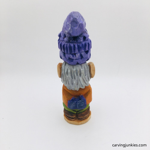 Back view of painted gnome carved from wood