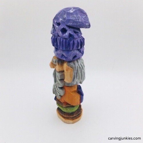Left view of painted hand carved wooden gnome