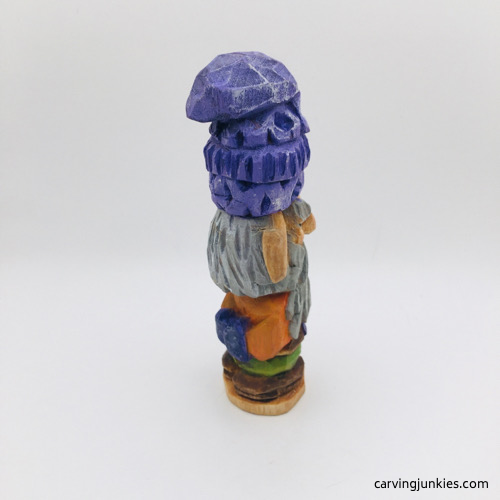 Right side of painted hand carved wooden gnome
