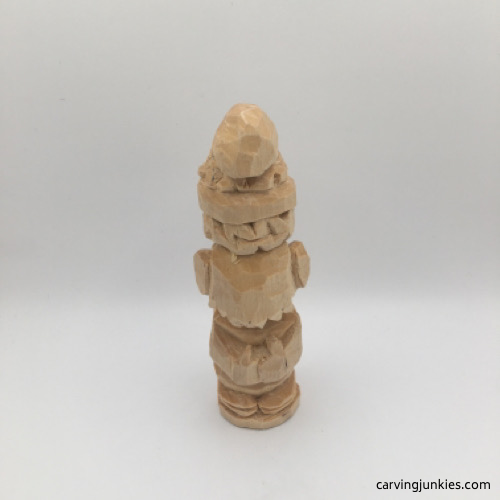 Back view of cuts made to back of wooden gnome