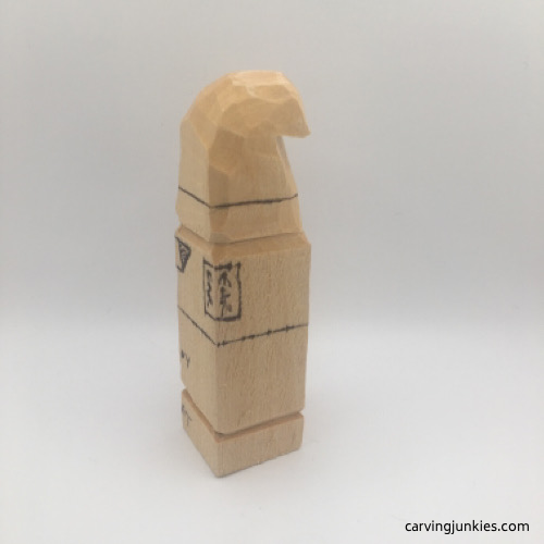 Progress on left side of gnome hat carving