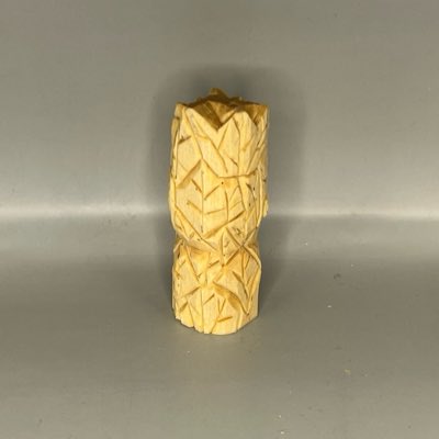 Back of unpainted wooden green man