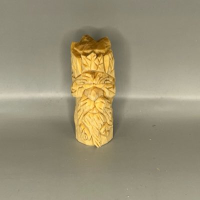 Front of unpainted wooden green man