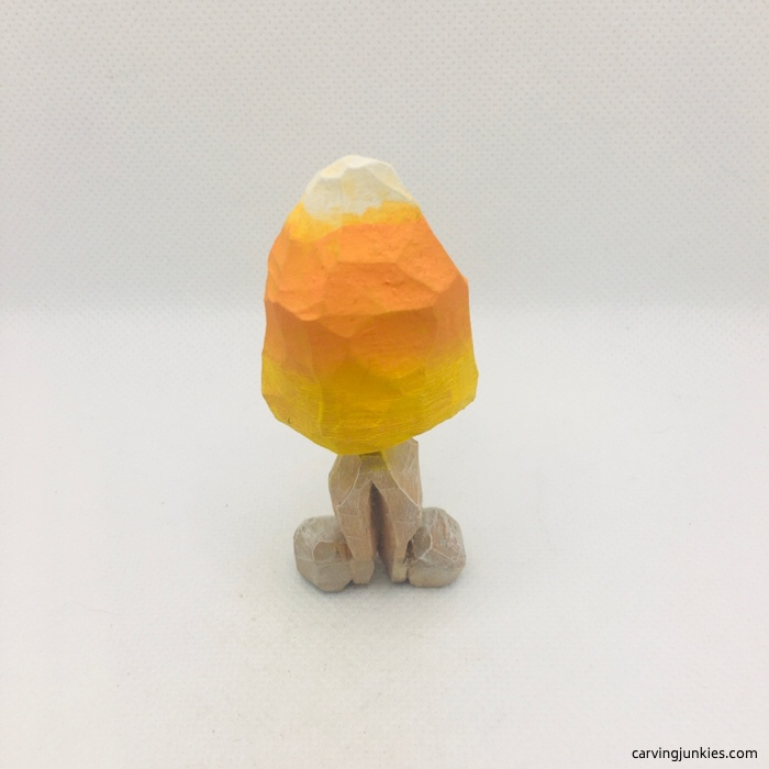 Back view of painted candy corn wood carving