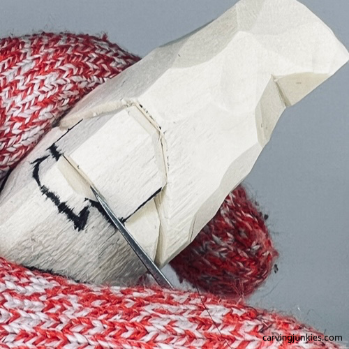 Nose guideline on Halloween gnome wood carving