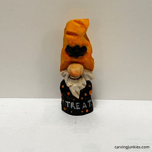 Front of painted Halloween gnome carving 