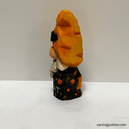 Left view of painted Halloween gnome carving