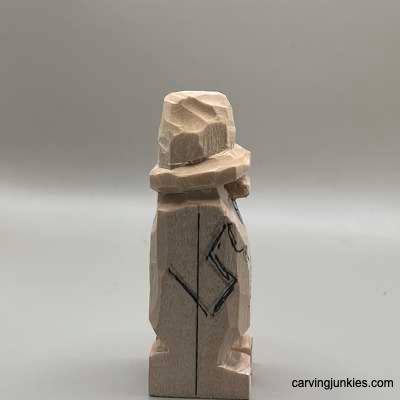 Right arm is sketched on hillbilly wood carving